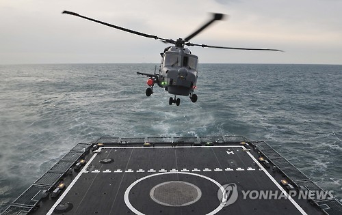 In this photo, taken on Feb. 1, 2017 and provided by the Navy, an AW-159 chopper takes off from the deck of a Navy ship in the southern seas off Geoje Island during a maritime drill aimed at detecting enemy submarines. (Yonhap)