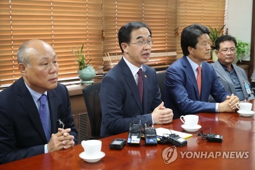 This photo taken on July 12, 2017, shows Unification Minister Cho Myoung-gyon (C) speaking at the start of a meeting with officials from local firms that ran factories at the now-shuttered Kaesong Industrial Complex. (Yonhap)