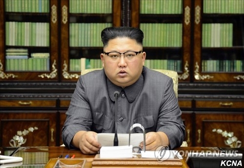This photo carried by North Korea's state news agency on Sept. 22, 2017 shows North Korean leader Kim Jong-un reading his statement condemning U.S. President Donald Trump for threatening to "totally destroy" the North. (For Use Only in the Republic of Korea. No Redistribution) (Yonhap)