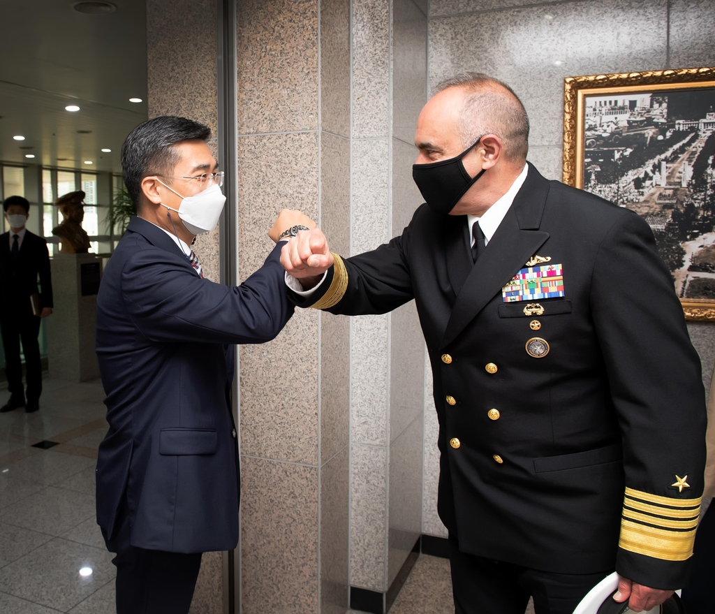 Defense Minister Suh Wook (L) greets Adm. Charles Richard, commander of the U.S. Strategic Command, in Seoul on July 14, 2021, in this photo provided by the defense ministry. (PHOTO NOT FOR SALE) (Yonhap)