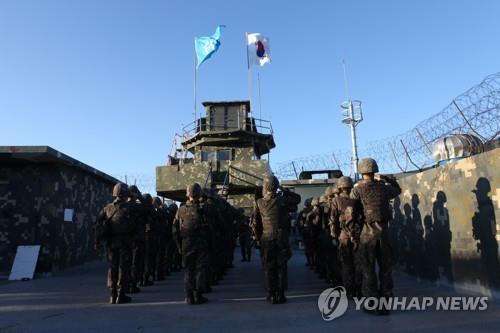 Flags of South Korea and the United Nations are brought down at a South Korean guard post in the Demilitarized Zone on Nov. 9, 2018, in this photo provided by the defense ministry. Ministry officials said South and North Korea each have withdrawn troops and firearms from 11 guard posts as of Nov. 10 for their complete demolition, one of the inter-Korean military agreements aimed at easing cross-border tensions. (PHOTO NOT FOR SALE) (Yonhap)