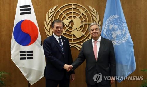 This file photo, dated on Sept. 24, 2019, shows South Korean President Moon Jae-in (L) shaking hands with U.N. Secretary-General Antonio Guterres during a meeting in New York. (Yonhap)