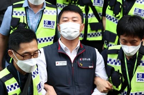 This Sept. 2, 2021, file photo shows Yang Kyung-soo, the chief of the Korean Confederation of Trade Unions being arrested by police in Seoul. (Yonhap)