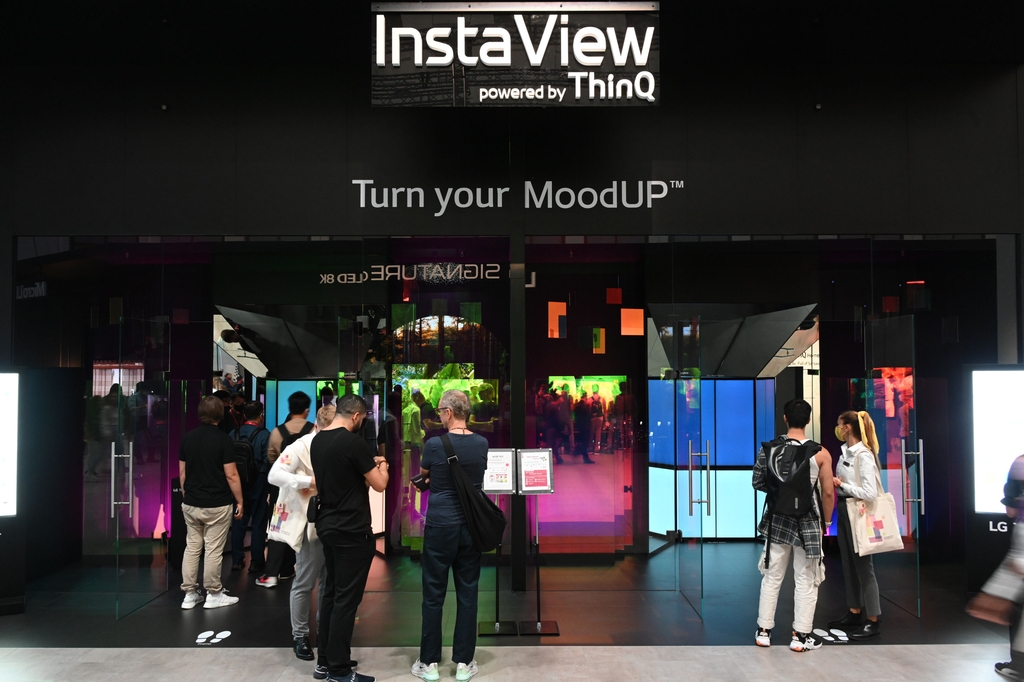 Visitors check out the MoodUp refrigerator at LG's exhibition booth at IFA 2022 in Berlin, in this photo provided by the company on Sept. 4, 2022. (PHOTO NOT FOR SALE) (Yonhap)
