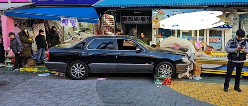 This photo provided by a reader shows a car that crashed at a conventional market in Seoul on Dec. 31, 2024. (PHOTO NOT FOR SALE) (Yonhap)