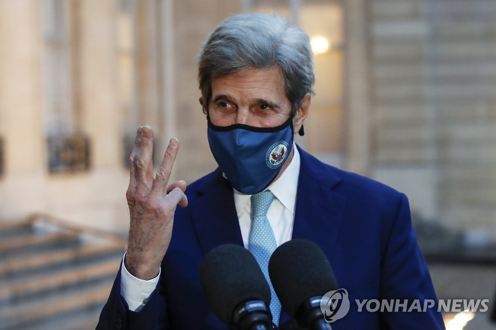 This file photo, released on March 10, 2021 by the Associated Press, shows U.S. Special Presidential Envoy for Climate John Kerry gesturing as he speaks to the media after a meeting with French President Emmanuel Macron at the Elysee Palace in Paris. (Yonhap)