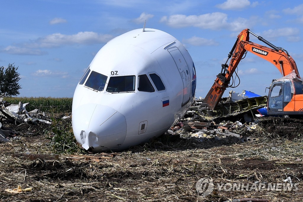 Dismantling Airbus A321 jet at crash landing site near Zhukovsky Airport