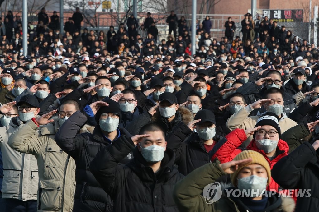 In this file photo, taken on Jan. 7, 2019, new military conscripts salute during a ceremony at a boot camp in the city of Nonsan, 213 kilometers south of Seoul, to mark the camp's first reception of recruits this year. All able-bodied South Korean males are required to serve almost two years in the military. (Yonhap) 