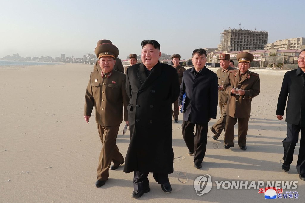 This photo, carried by North Korea's state news agency on April 6, 2019, shows its leader Kim Jong-un (C) inspecting the Wonsan-Kalma coastal tourist area. (For Use Only in the Republic of Korea. No Redistribution) (Yonhap)
