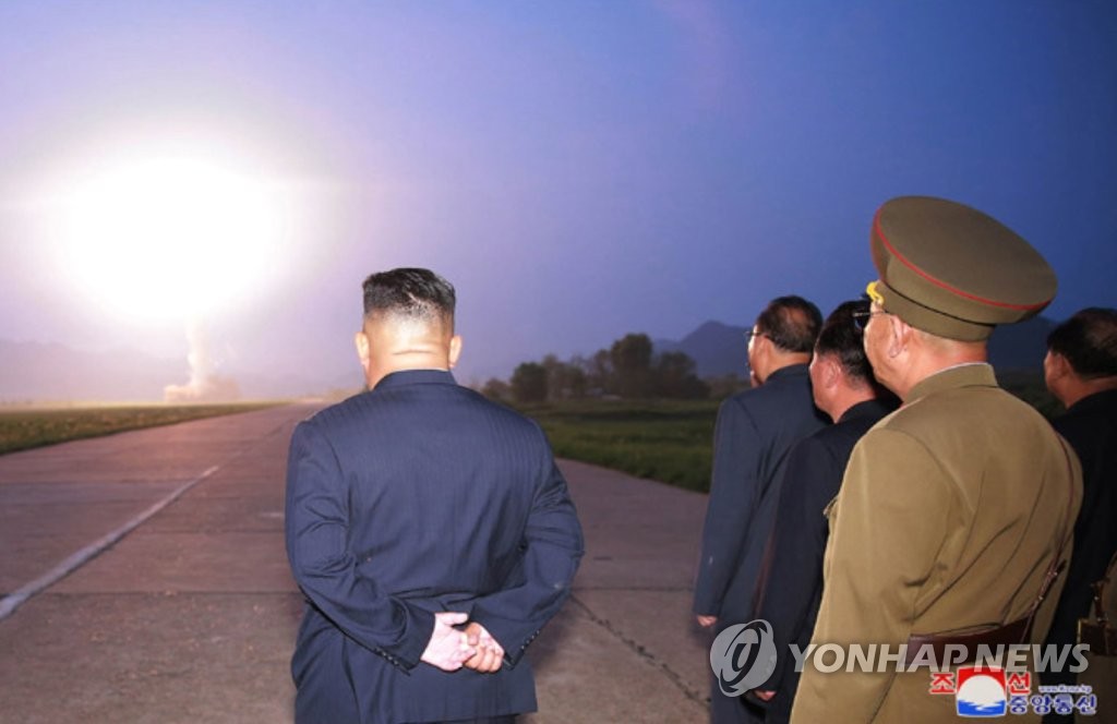 North Korean leader Kim Jong-un (L) watches the launch of a new tactical guided missile on Aug. 6, 2019, in this photo released by the Korean Central News Agency the next day. North Korea fired two projectiles believed to be short-range ballistic missiles into the East Sea on Aug. 6, the fourth such launch in less than two weeks. (For Use Only in the Republic of Korea. No Redistribution) (Yonhap)