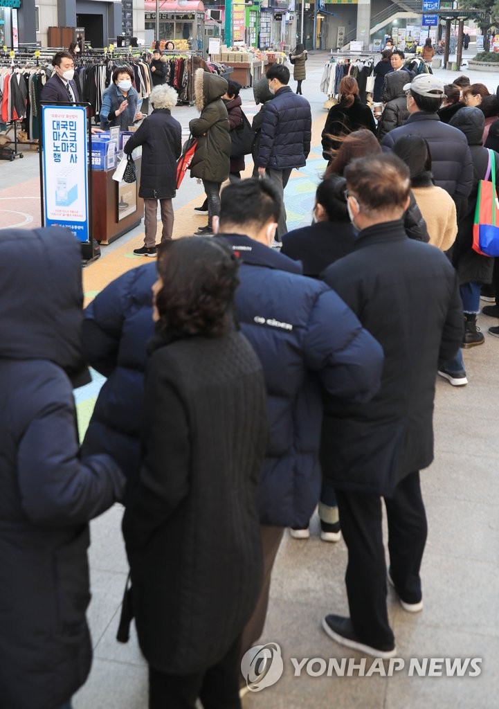 People line up to buy masks People line up to buy masks