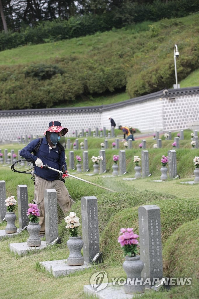 Cleaning democracy fighters' tombs Cleaning democracy fighters' tombs