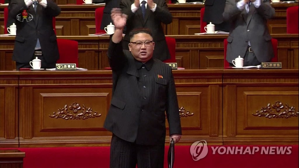 North Korean leader Kim Jong-un waves to participants at the eighth congress of the ruling Workers' Party in Pyongyang on Jan. 12, 2021, in this photo captured from the North's state TV the next day. (For Use Only in the Republic of Korea. No Redistribution) (Yonhap) 