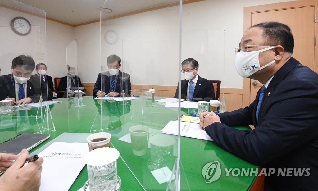 This photo taken on March 7, 2021, and provided by the finance ministry shows Finance Minister Hong Nam-ki (R), Land Minister Byeon Chang-heum (2nd from R) and other relevant ministers holding a meeting to handle recent speculative land transactions by public officials. (PHOTO NOT FOR SALE) (Yonhap)
