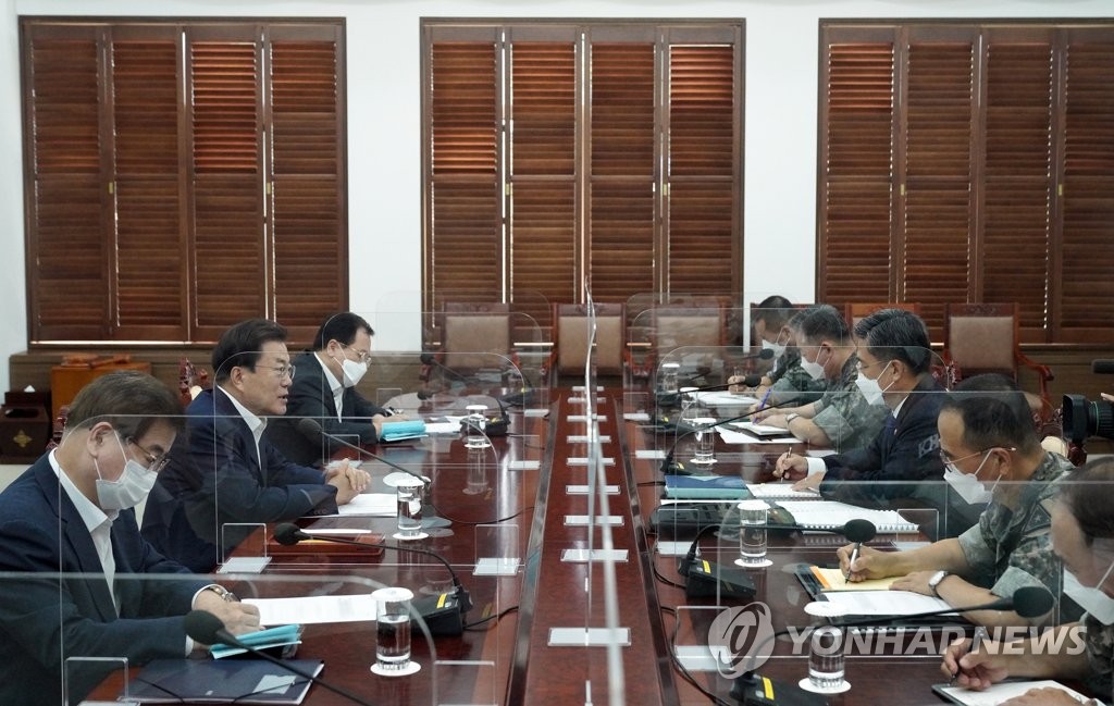 President Moon Jae-in (2nd from L) speaks during a meeting with South Korea's top military leaders at Cheong Wa Dae in Seoul on Aug. 4, 2021, in this photo provided by his office. (PHOTO NOT FOR SALE) (Yonhap)