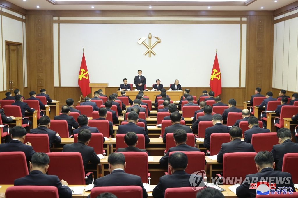 North Korean Premier Kim Tok-hun (standing) speaks during a plenary session of the central committee of North Korea's ruling Workers' Party on the event's third day on Dec. 29, 2021, in this photo released by the Korean Central News Agency the next day. (For Use Only in the Republic of Korea. No Redistribution) (Yonhap) 