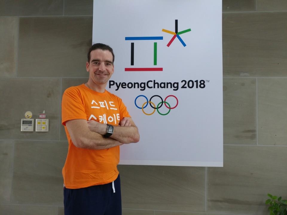 Bob de Jong, an assistant coach for the South Korean speed skating team from the Netherlands, poses next to the banner for the 2018 PyeongChang Winter Olympics at the National Training Center in Seoul on June 16, 2017. His t-shirt says "speed skating" in Korean. (Yonhap)