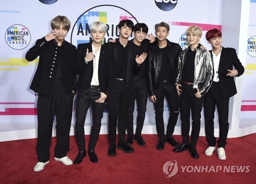 In this AP file photo, members of BTS pose for photographers upon arriving at the American Music Awards at Microsoft Theater in Los Angeles on Nov. 19, 2017. (Yonhap)