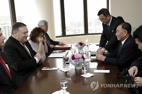 This AP photo shows U.S. Secretary of State Mike Pompeo (L) meeting with Kim Yong-chol (R), vice chairman of the central committee of North Korea's ruling Workers' Party, in New York on May 31, 2018. (Yonhap)