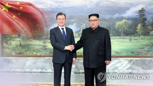 This image shows summit talks between South Korean President Moon Jae-in and North Korea's leader Kim Jong-un. (Yonhap)