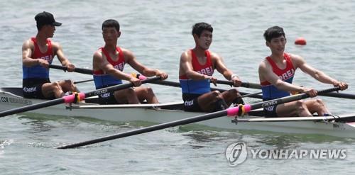 In this file photo taken on Aug. 19, 2018, rowers from South Korea and North Korea compete in the men's lightweight four at the 18th Asian Games in Indonesia. (Yonhap)