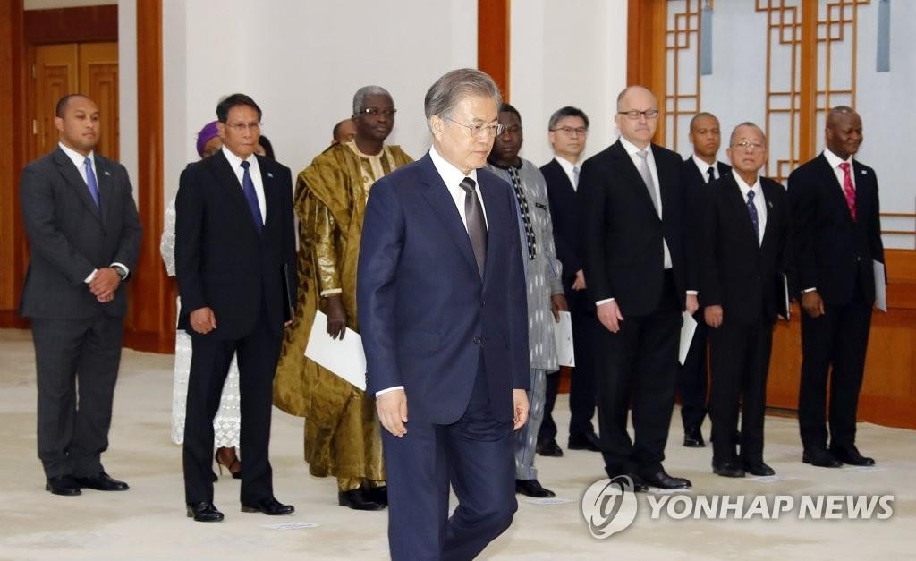 In this file photo, dated on May 31, 2019, President Moon Jae-in enters a Cheong Wa Dae room to receive the credentials of newly appointed foreign ambassadors to South Korea. (Yonhap)