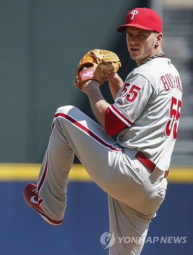 In this EPA file photo from Sept. 3, 2014, David Buchanan of the Philadelphia Phillies pitches against the Atlanta Braves in the bottom of the first inning of a Major League Baseball regular season game at Turner Field in Atlanta. (Yonhap) 