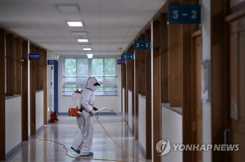 A Seoul high school is disinfected on May 11, 2020. (Yonhap)