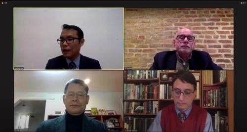The unification ministry holds a videoconference with Former Unification Minister Kim Yeon-chul (bottom, L), Joel Wit (top, R), a senior fellow at the Washington-based think tank Stimson Center and founder of the 38 North website, and Frank Januzzi (bottom, R), head of the Mansfield Foundation, on Dec. 18, 2020, in this photo captured from YouTube. (PHOTO NOT FOR SALE) (Yonhap)