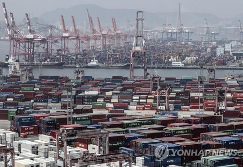 This file photo shows stacks of import-export cargo containers at South Korea's largest seaport in Busan, 450 kilometers southeast of Seoul. (Yonhap)