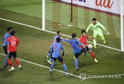 In this file photo from Dec. 18, 2019, South Korea (in red tops) and Japan are in action in the final of the East Asian Football Federation (EAFF) E-1 Football Championship at Busan Asiad Main Stadium in Busan, 450 kilometers southeast of Seoul. (Yonhap)