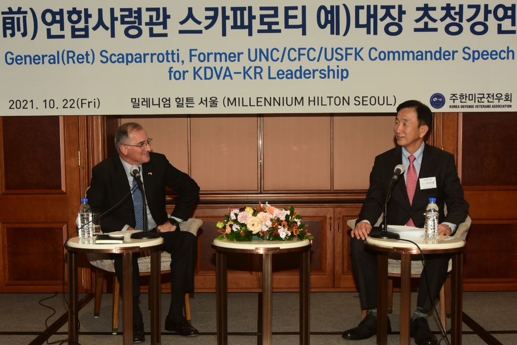 This photo, released by the Korea Chapter of the Korea Defense Veterans Association, shows former U.S. Forces Korea (USFK) chief Curtis Scaparrotti (L) and Lee Seo-young, president of the chapter, talking during a dinner gathering at a hotel in Seoul on Oct. 22, 2021. (PHOTO NOT FOR SALE) (Yonhap)