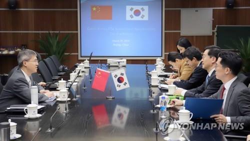 This file photo, provided by Seoul's Ministry of Trade, Industry and Energy on March 29, 2019, shows South Korean and Chinese officials holding the fourth round of free trade agreement (FTA) follow-up negotiations in the service and investment segments in Beijing.