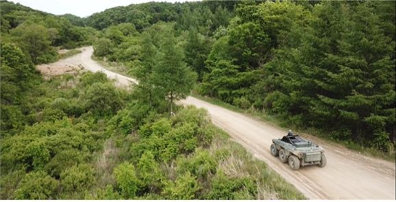 This photo released by the Agency for Defense Development (ADD) on May 23, 2022, shows a military vehicle running at an undisclosed location with new self-driving technology. (PHOTO NOT FOR SALE) (Yonhap)