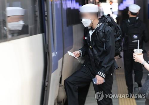 This file photo, taken May 1, 2022, shows a service member boarding a train at Seoul Station in central Seoul. (Yonhap)