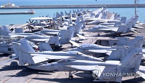 Military aircraft are seen aboard the USS Ronald Reagan aircraft carrier in South Korea's southeastern city of Busan on Sept. 23, 2022. (Pool photo) (Yonhap)