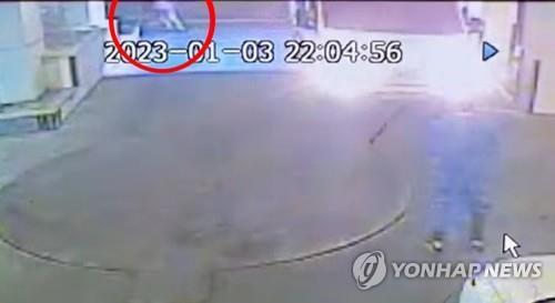 This closed-circuit TV image, provided by a hotel in Incheon, west of Seoul, shows a 41-year-old Chinese man (in the red circle) escaping the hotel on Jan. 3, 2023. (PHOTO NOT FOR SALE) (Yonhap)