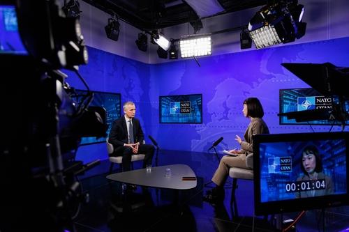 This photo, provided by the North Atlantic Treaty Organization (NATO), shows NATO Secretary General Jens Stoltenberg (L) having an interview with Yonhap News Agency in Brussels, Belgium, on Jan. 27, 2023. (PHOTO NOT FOR SALE) (Yonhap) 