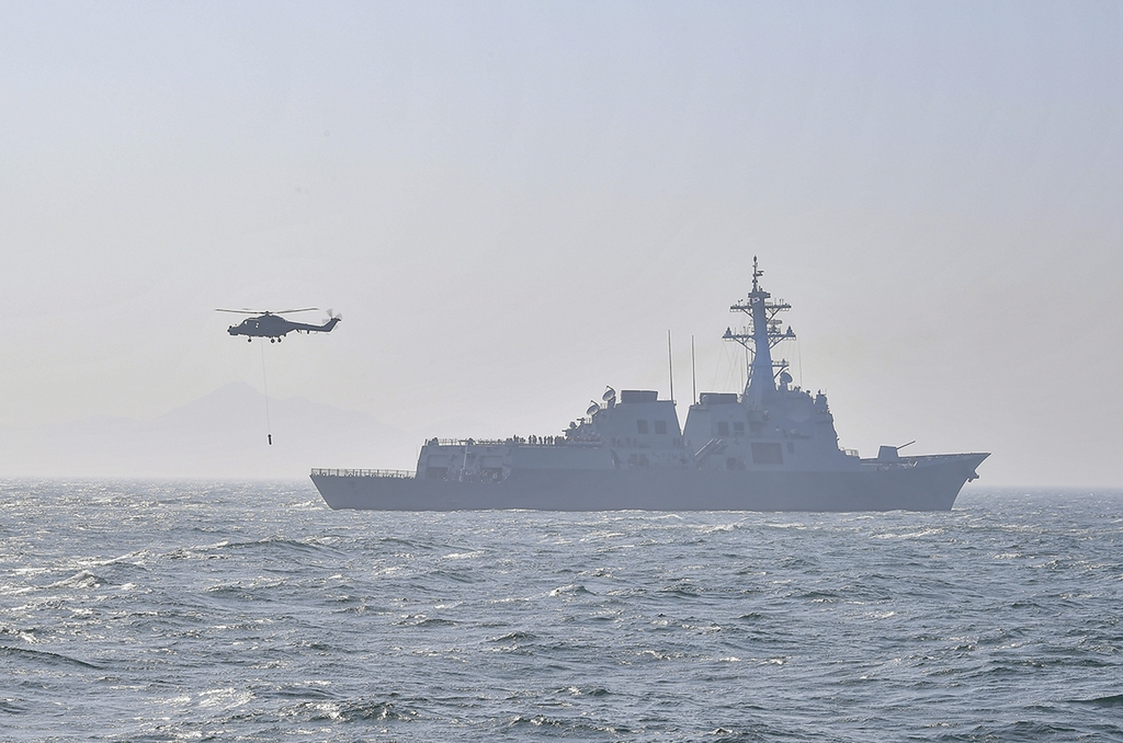 A Lynx maritime helicopter stages an anti-submarine exercise with the Sejong the Great destroyer in waters just south of Busan, 320 km southeast of Seoul, on May 16, 2023, in this photo released by the Navy on May 18. (PHOTO NOT FOR SALE) (Yonhap)