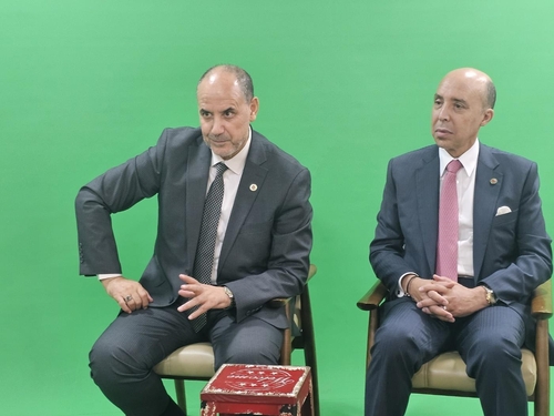Ahmed Abaddi (L), the secretary general of the Mohammedian League of Religious Scholars of Morocco, seated next to Moroccan Ambassador to South Korea Chafik Rachadi, speaks during an interview with Yonhap News Agency on Sept. 19, 2023. (Yonhap)