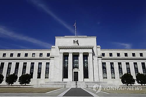 U.S. Fed holds key lending rate steady