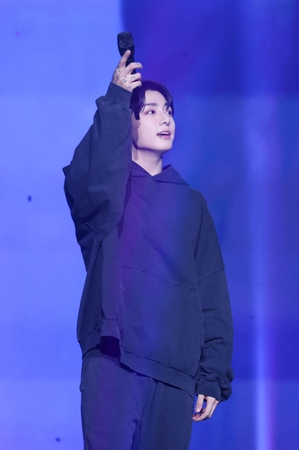 This photo provided by BigHit Music shows BTS member Jungkook performing during a concert at Jangchung Arena in Seoul on Nov. 20, 2023. (PHOTO NOT FOR SALE) (Yonhap)