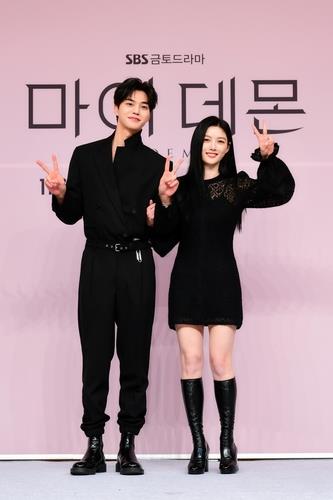 Song Kang (L) and Kim Yoo-jung pose for photos at a press event for the upcoming television series "My Demon" in Seoul on Nov. 24, 2023, in this photo provided by SBS TV. (PHOTO NOT FOR SALE) (Yonhap)