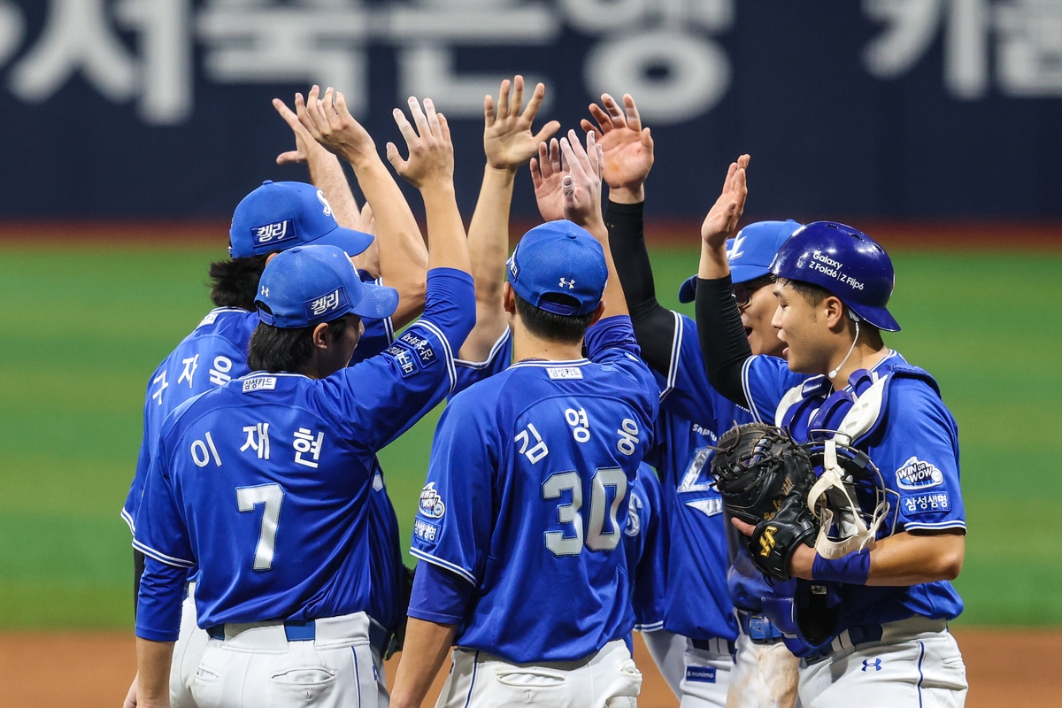 Samsung Lions players celebrate their 1-0 win over the Kiwoom Heroes in the teams' Korea Baseball Organization regular-season game at Gocheok Sky Dome in Seoul on Aug. 27, 2024, in this photo provided by the Lions. (PHOTO NOT FOR SALE) (Yonhap)