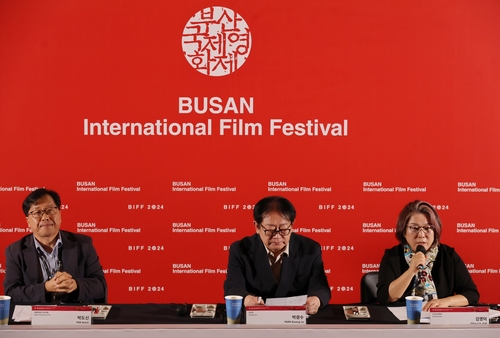 Officials at the Busan International Film Festival (BIFF) attend a press event, wrapping up its 10-day run, in Busan on Oct. 11, 2024. (Yonhap)