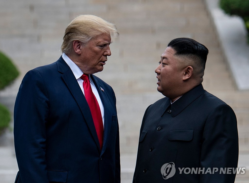 This AFP photo shows U.S. President Donald Trump (L) and North Korean leader Kim Jong-un meeting in the Demilitarized Zone on the inter-Korean border on June 30, 2019. (Yonhap)
