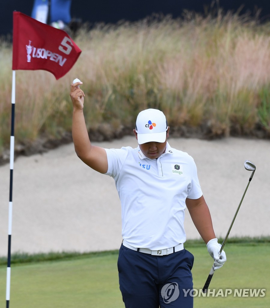 In this EPA photo, Kim Joo-hyung of South Korea celebrates his eagle on the fifth hole during the third round of the 122nd U.S. Open at The Country Club in Brookline, Massachusetts, on June 18, 2022. (Yonhap)
