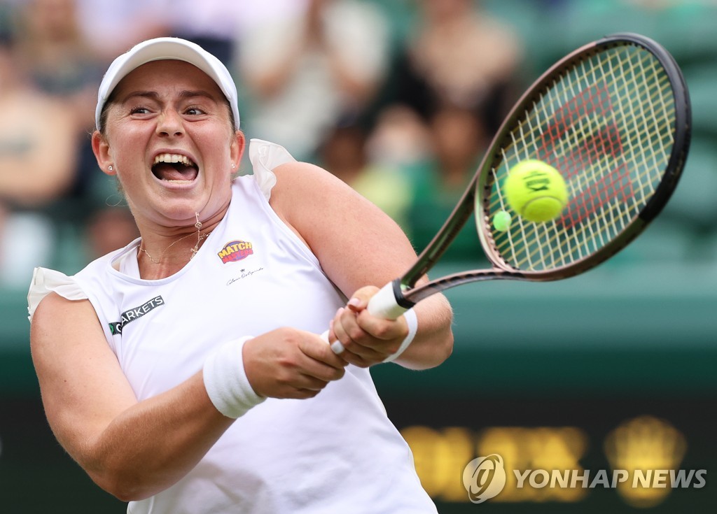 In this EPA file photo from July 3, 2022, Jelena Ostapenko of Latvia hits a shot against Tatjana Maria of Germany during their women's singles round of 16 match at Wimbledon at All England Club in London. (Yonhap)