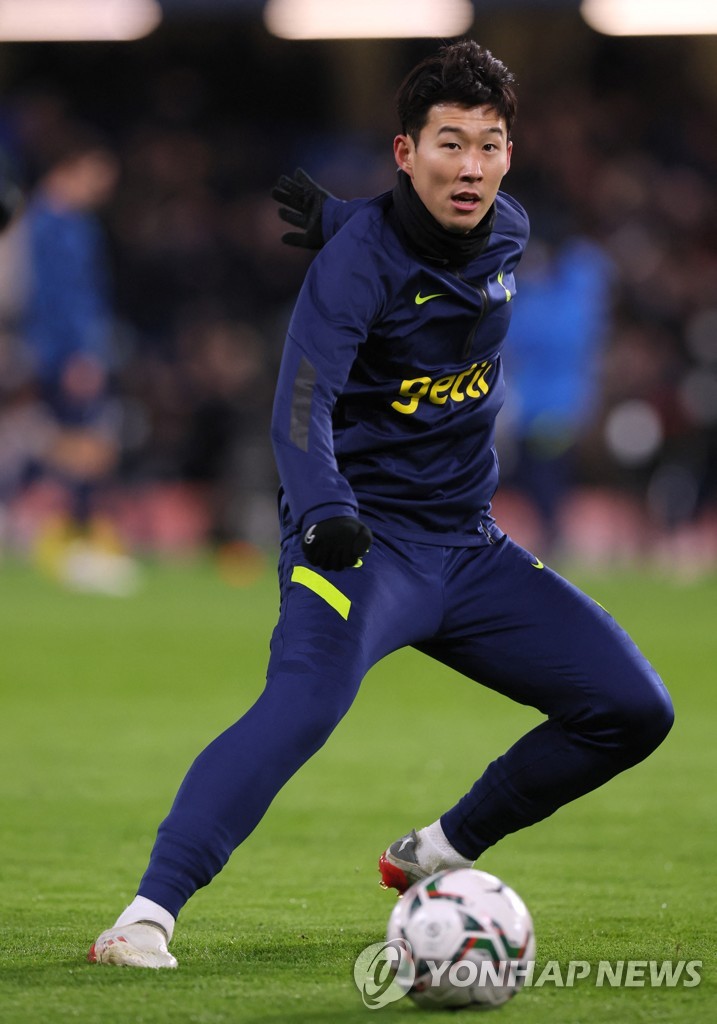 In this Action Images photo via Reuters, Son Heung-min of Tottenham Hotspur warms up before facing Chelsea in the first leg of the Carabao Cup semifinals at Stamford Bridge in London on Jan. 5, 2022. (Yonhap)
