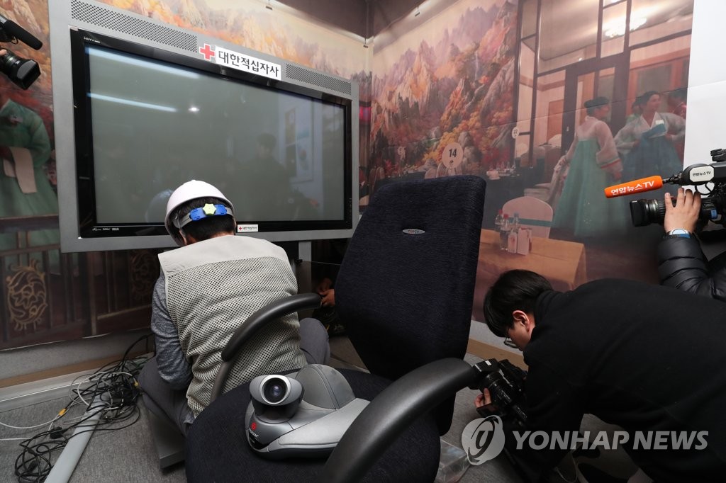Renovation work is underway at a video reunion center set up inside South Korea's Red Cross building in central Seoul on April 3, 2019, with a monitor being taken down. (Yonhap)